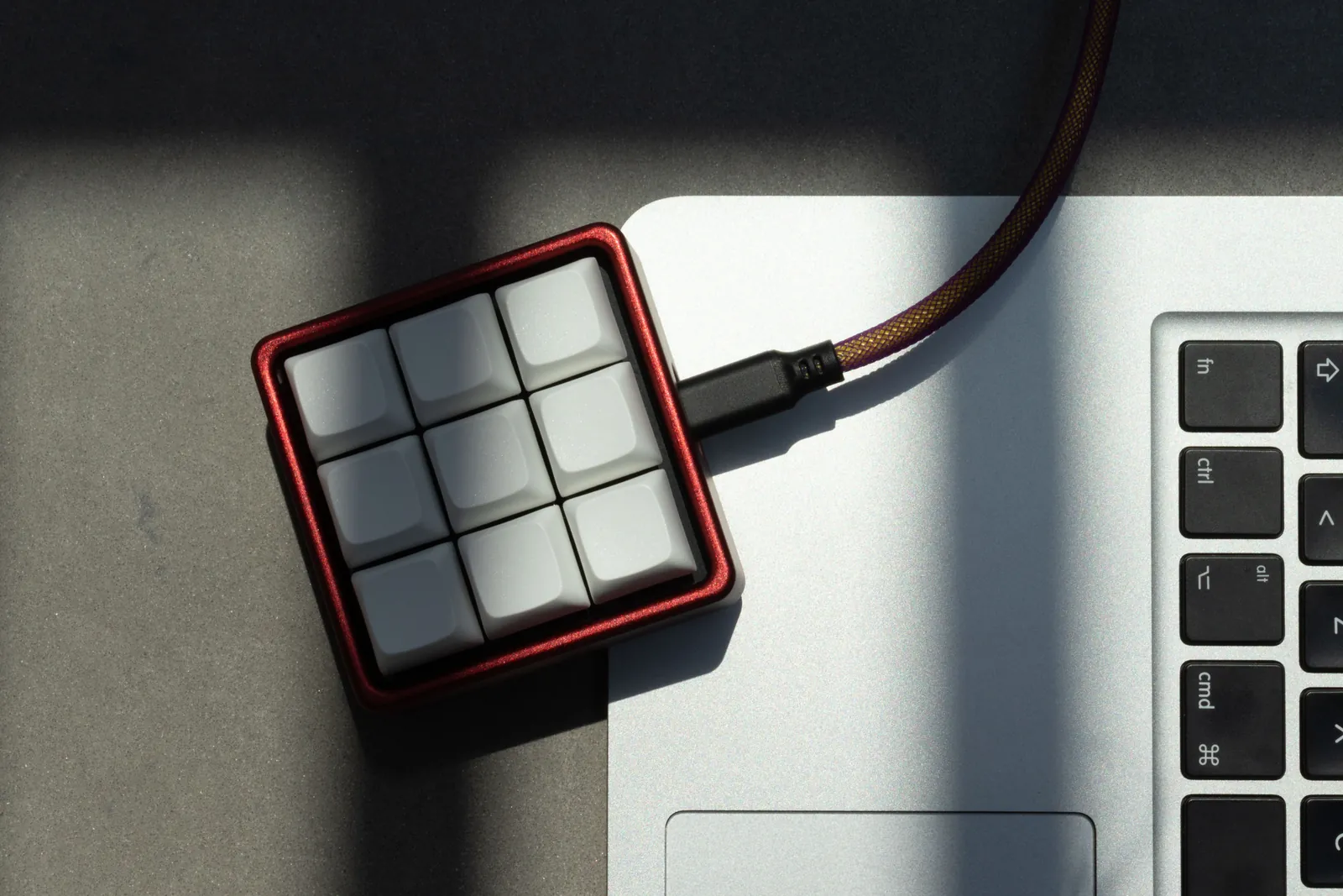 Red Enclave in use beside a laptop keyboard